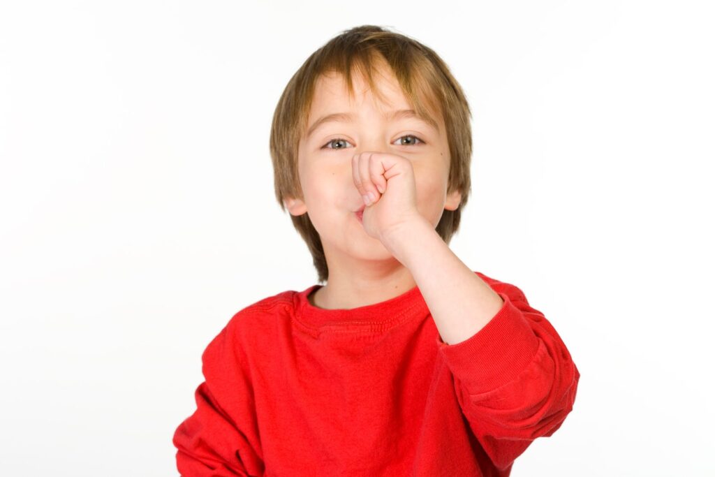 Young boy sucking his thumb – a common cause of open bite in children